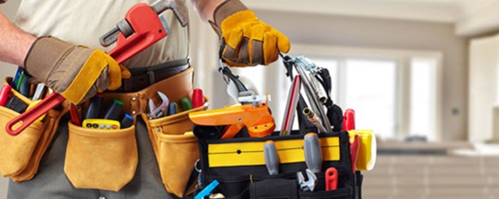 Professional maintenance worker carrying out building maintenance
